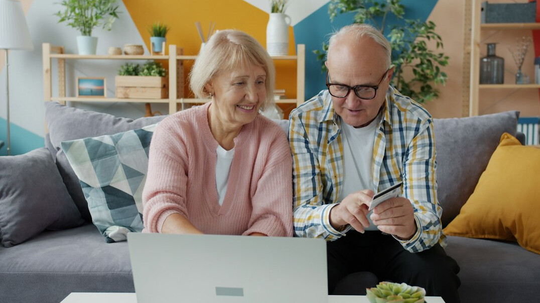 elderly couple reviewing documents