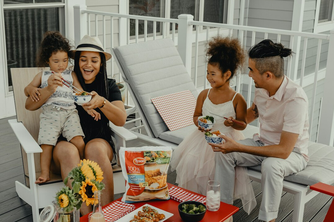 family enjoying picnic outdoors